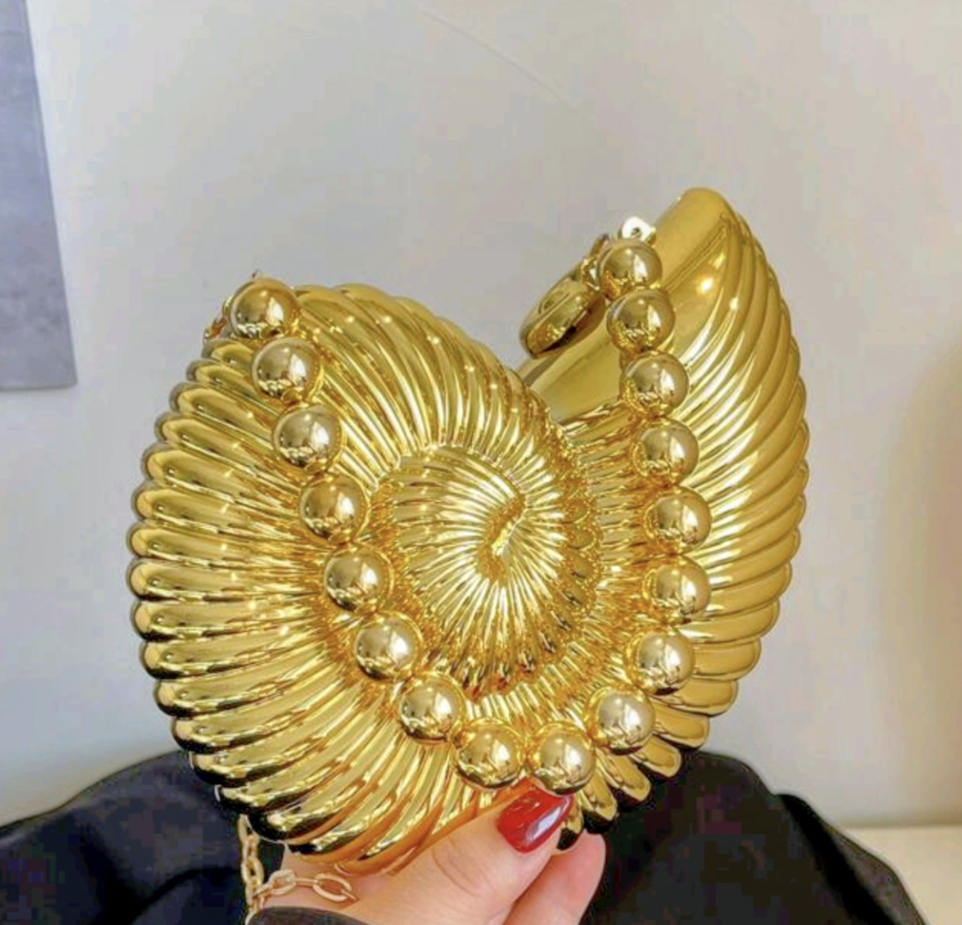 Gold nautilus shell evening clutch